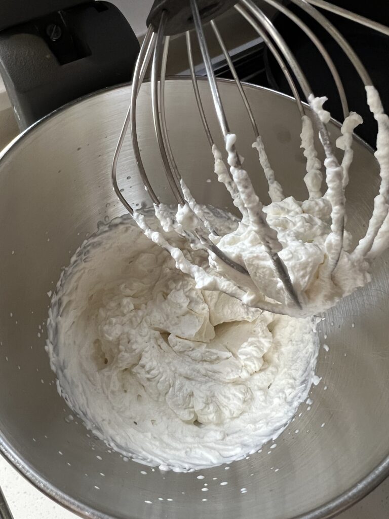 Served Seasonal Salted Maple Whipped Cream just after the whipping process in a Kitchen Aid stand mixer.