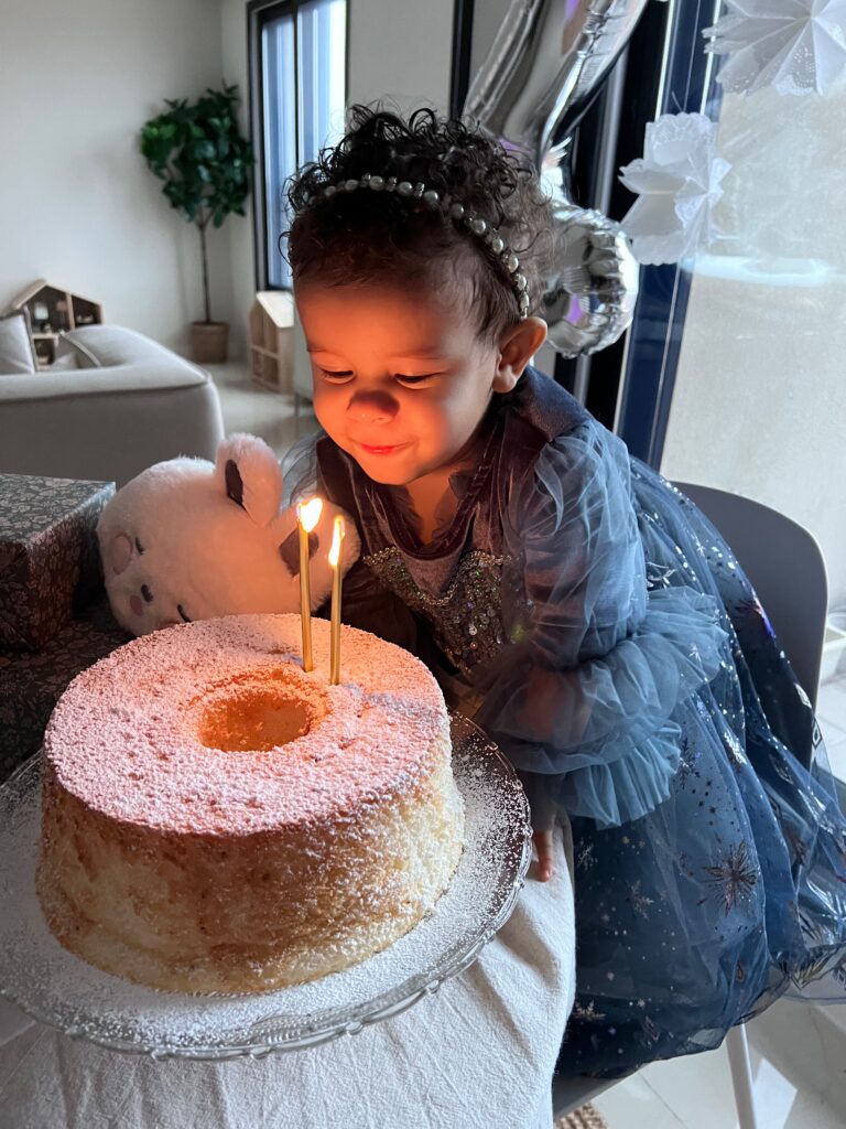 Arla's winter birthday brunch. Arla with her angel food birthday cake.