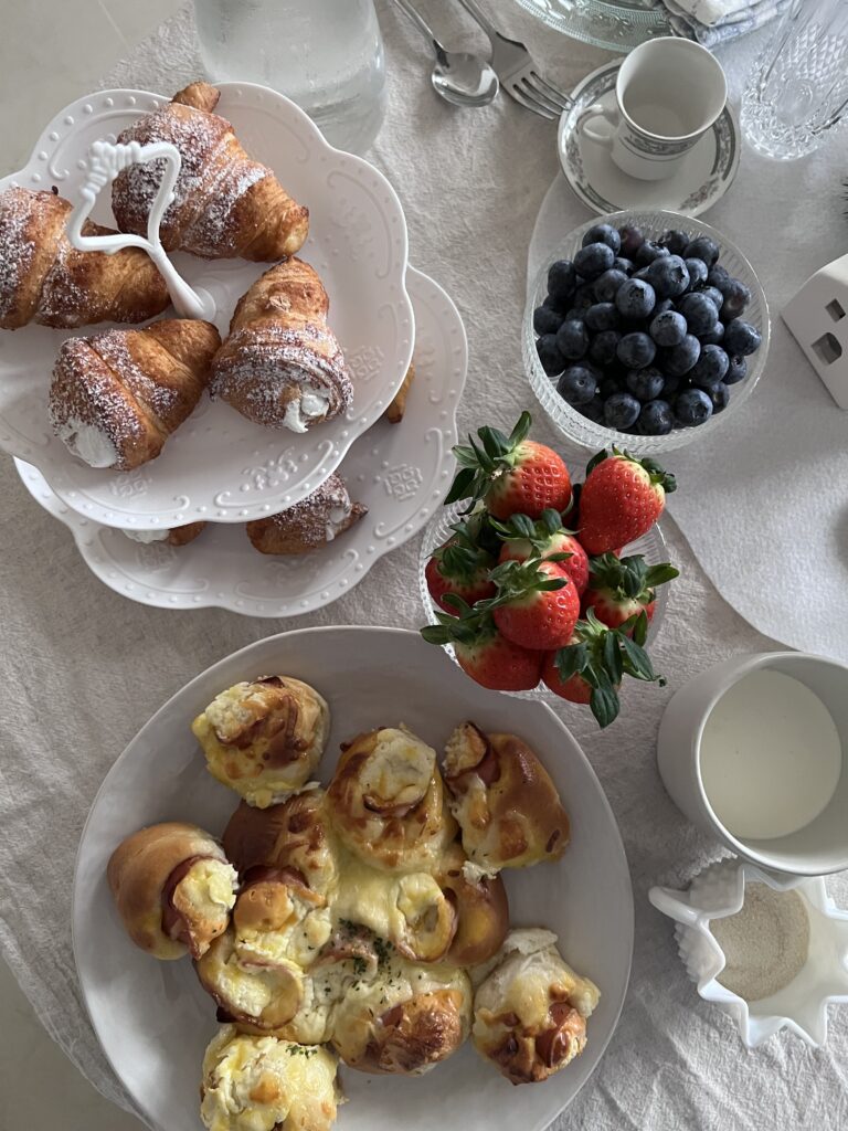 Details of food from Arla's winter birthday brunch.. Cream filled croissants, ham & cheese breakfast rolls, fresh strawberries and blueberries. 